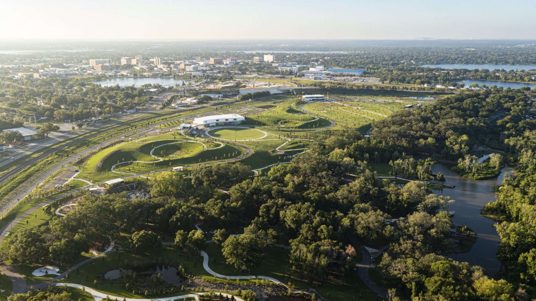 Aerial view of the park at dusk with a view of the city of Lakeland in the distance