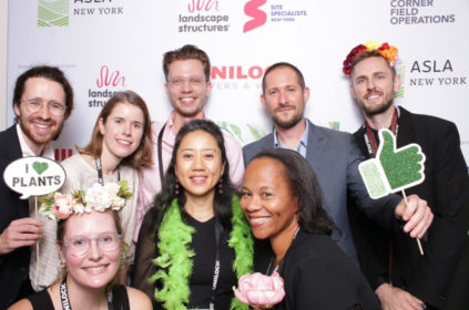 Photo of a group of people smiling at a photobooth at an ASLA event