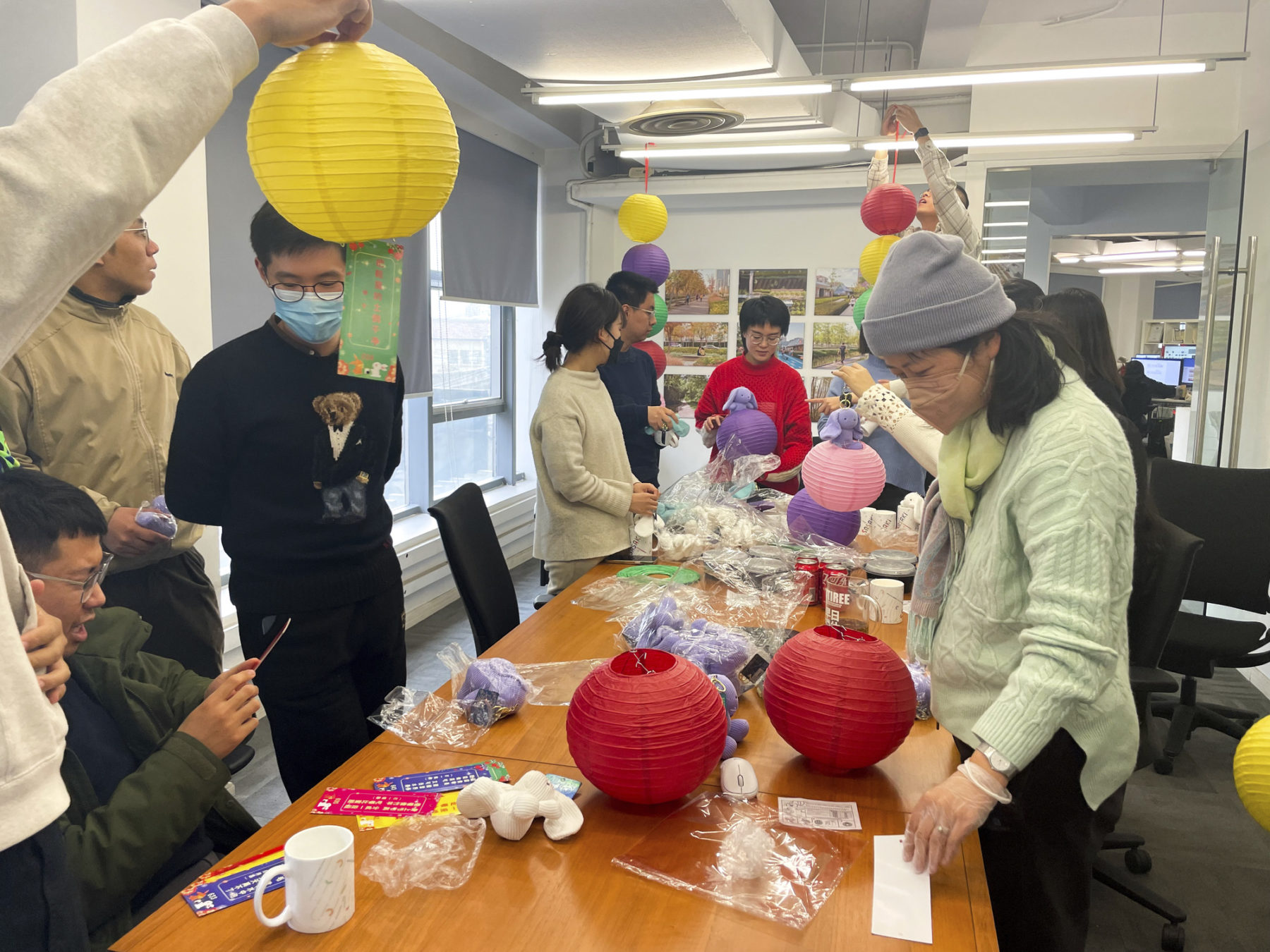 people building paper lanterns together