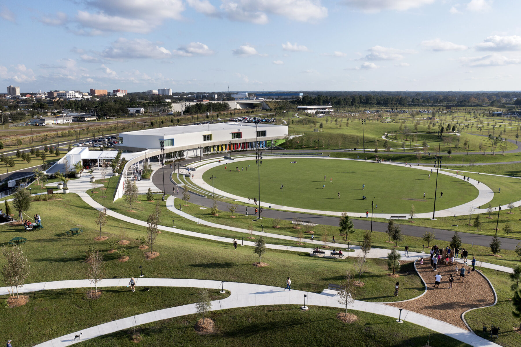 Aerial view of the circular event lawn and walking paths situated in between two hills