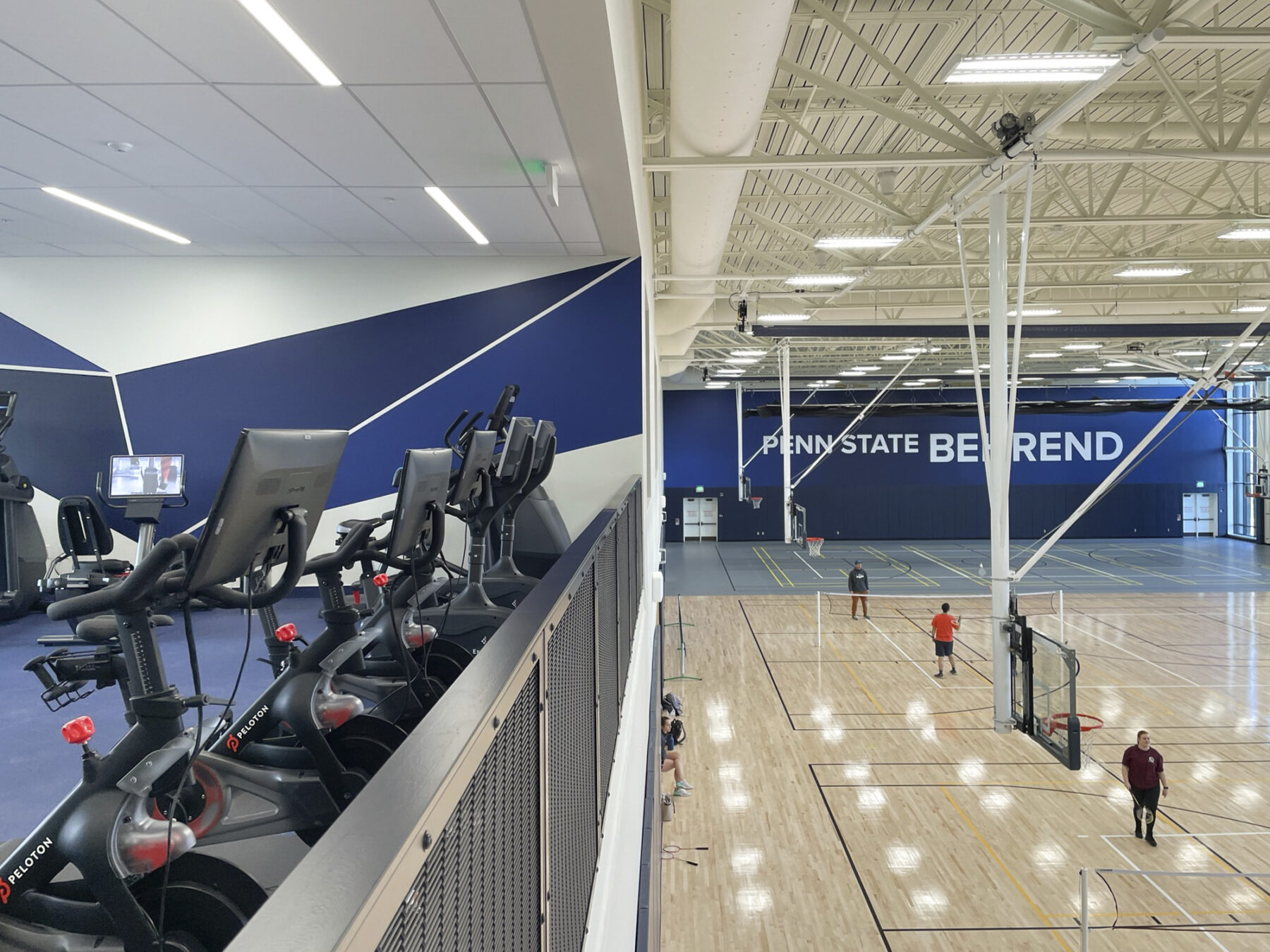 View of the bike machines on the second floor overlooking the basketball court below