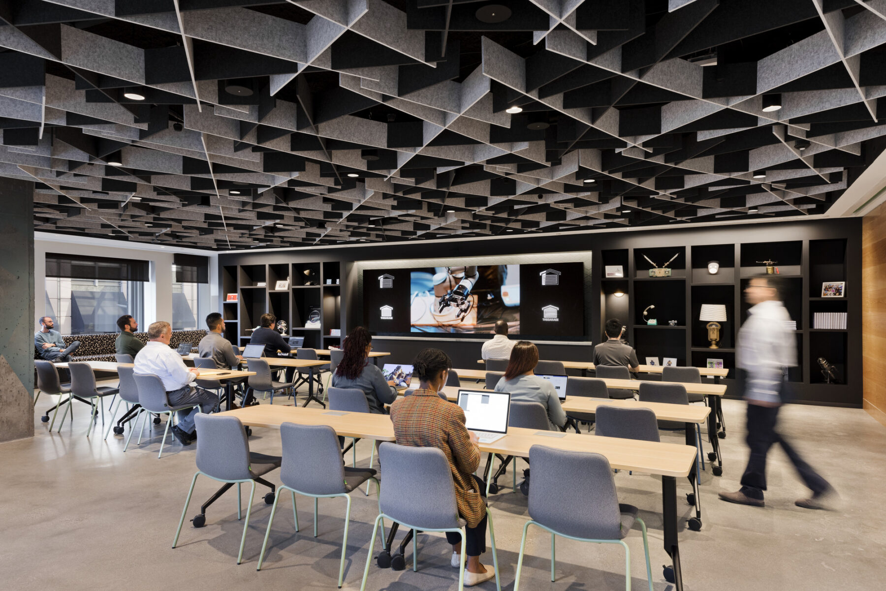 Open meeting room with large interactive screen at the front
