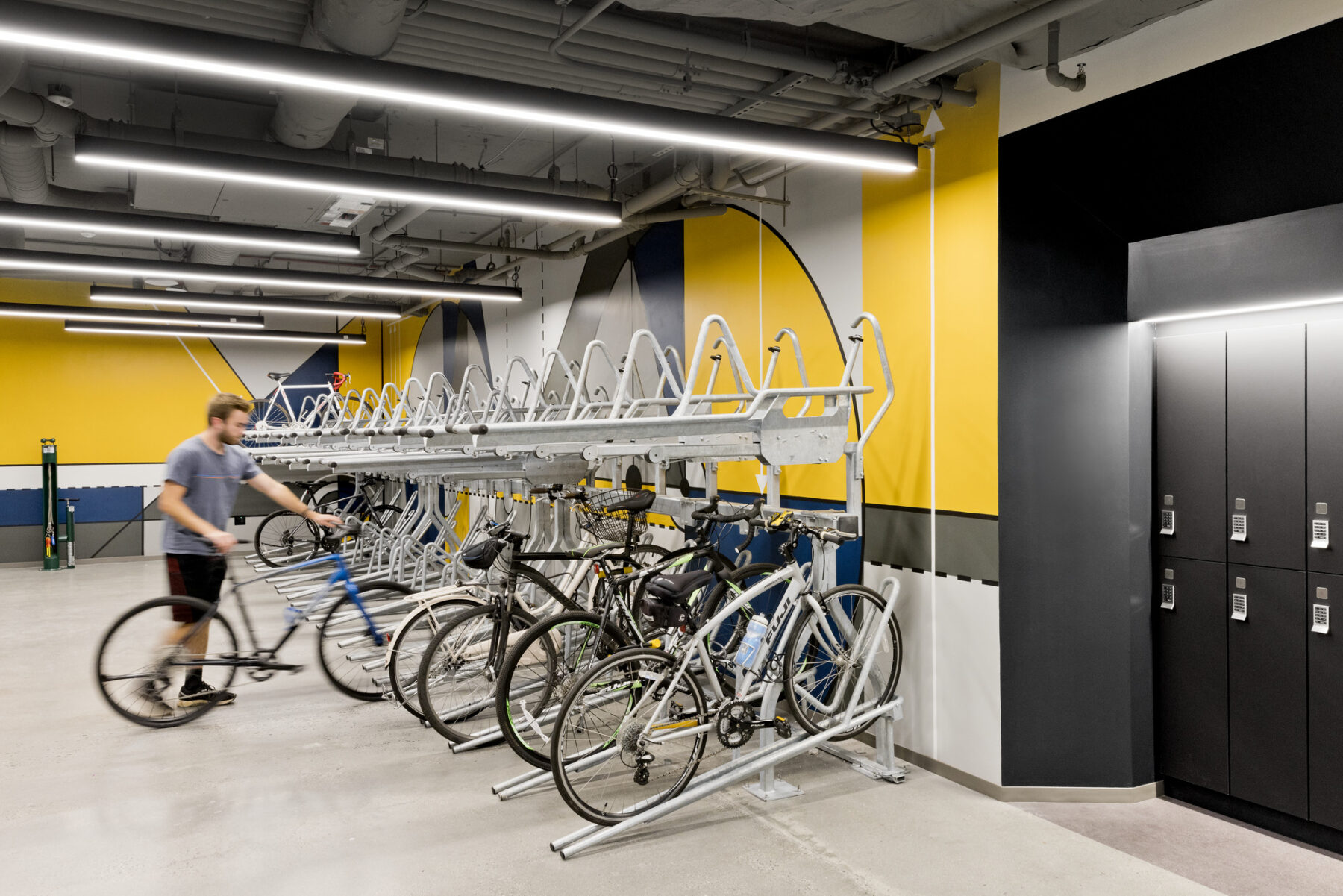 Bike room with racks and individual parking their bike