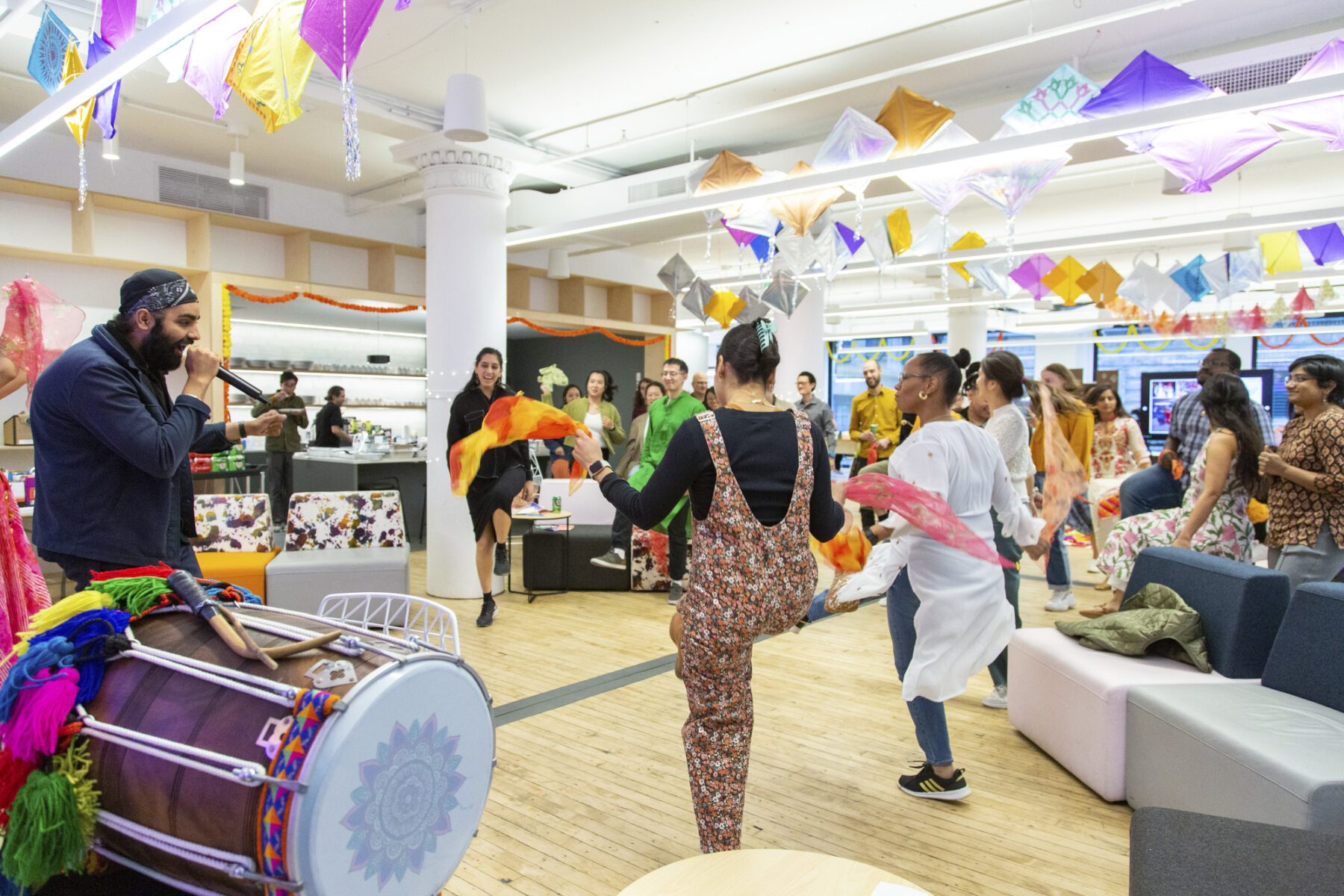 a group of people dancing together in a big room