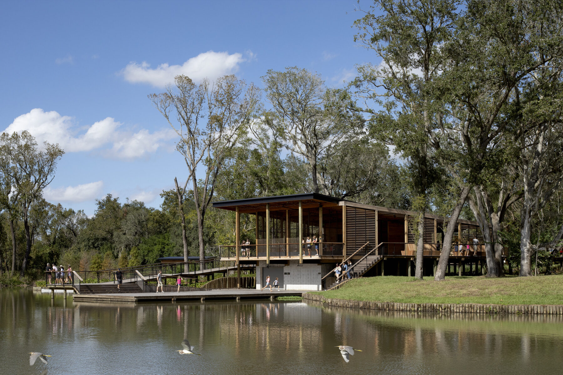 photograph of boathouse from across lagoon