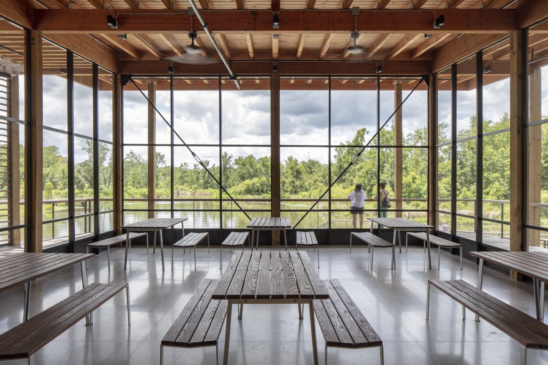 photograph taken from inside screened-in pergola with views over the lagoon