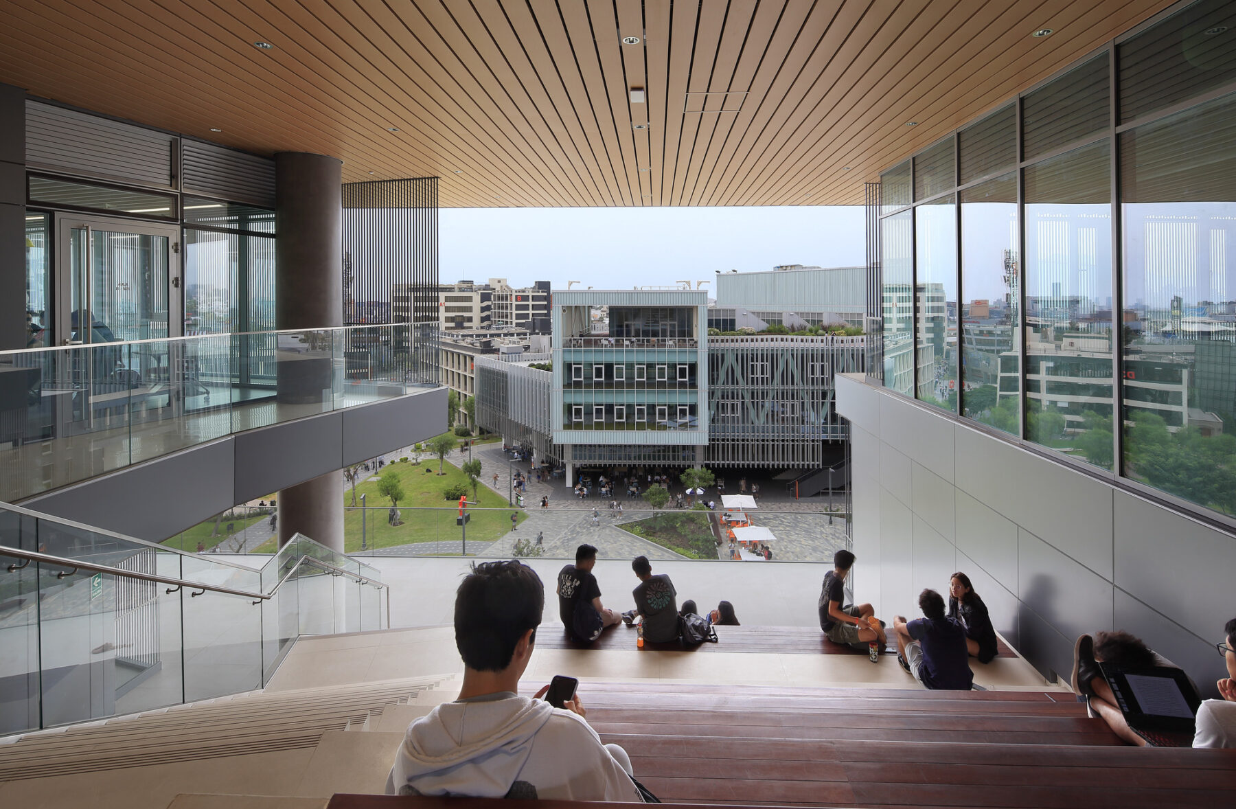 photograph of students on outdoor terrace with views towards recreation center