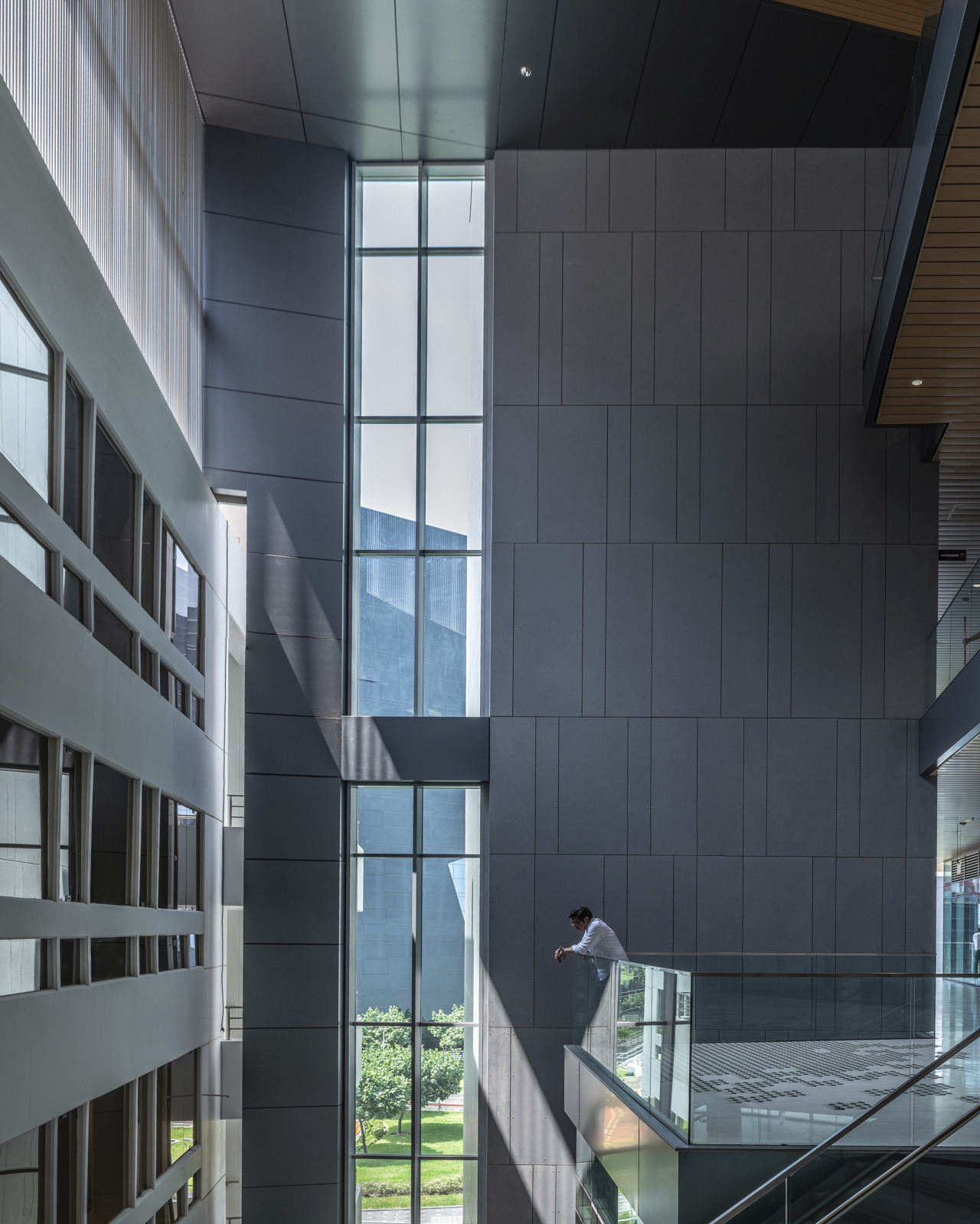 photograph of man overlooking the first floor of engineering center