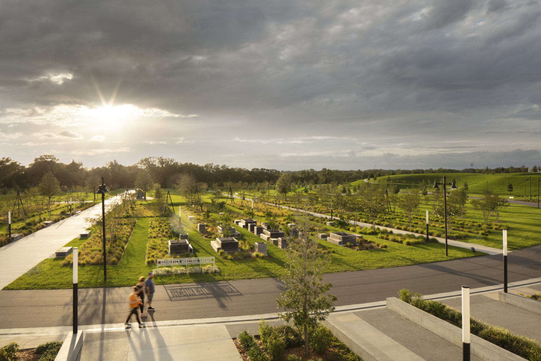 photograph taken from second level patio of welcome center overlooking the heritage gardens during a sunset