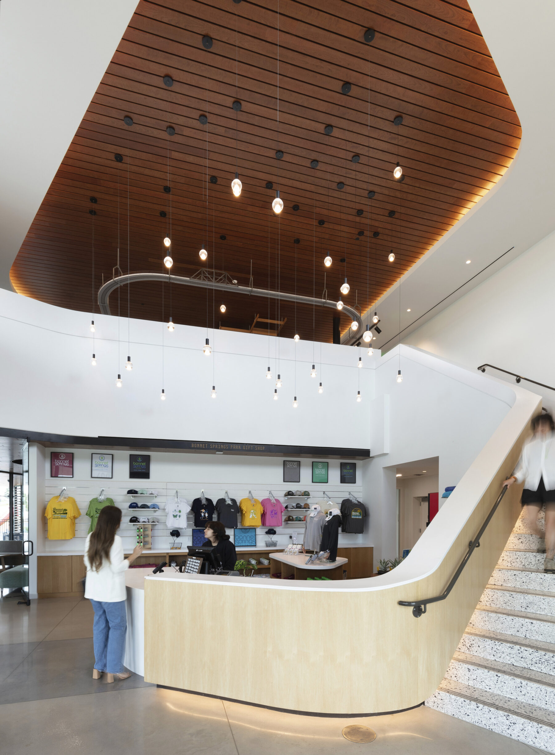 interior photograph of welcome center lobby showing the terrazzo staircase and exposed pine ceilings