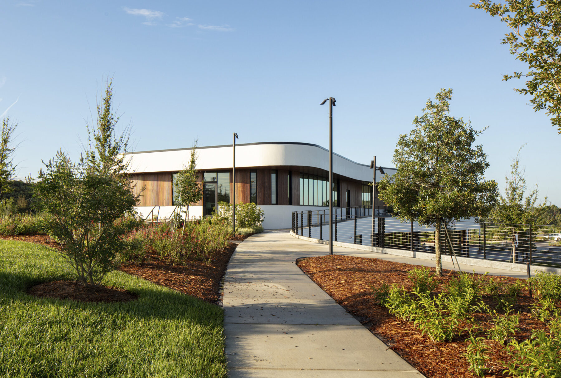 photograph of walking path on hill that leads into second level patio of Welcome Center