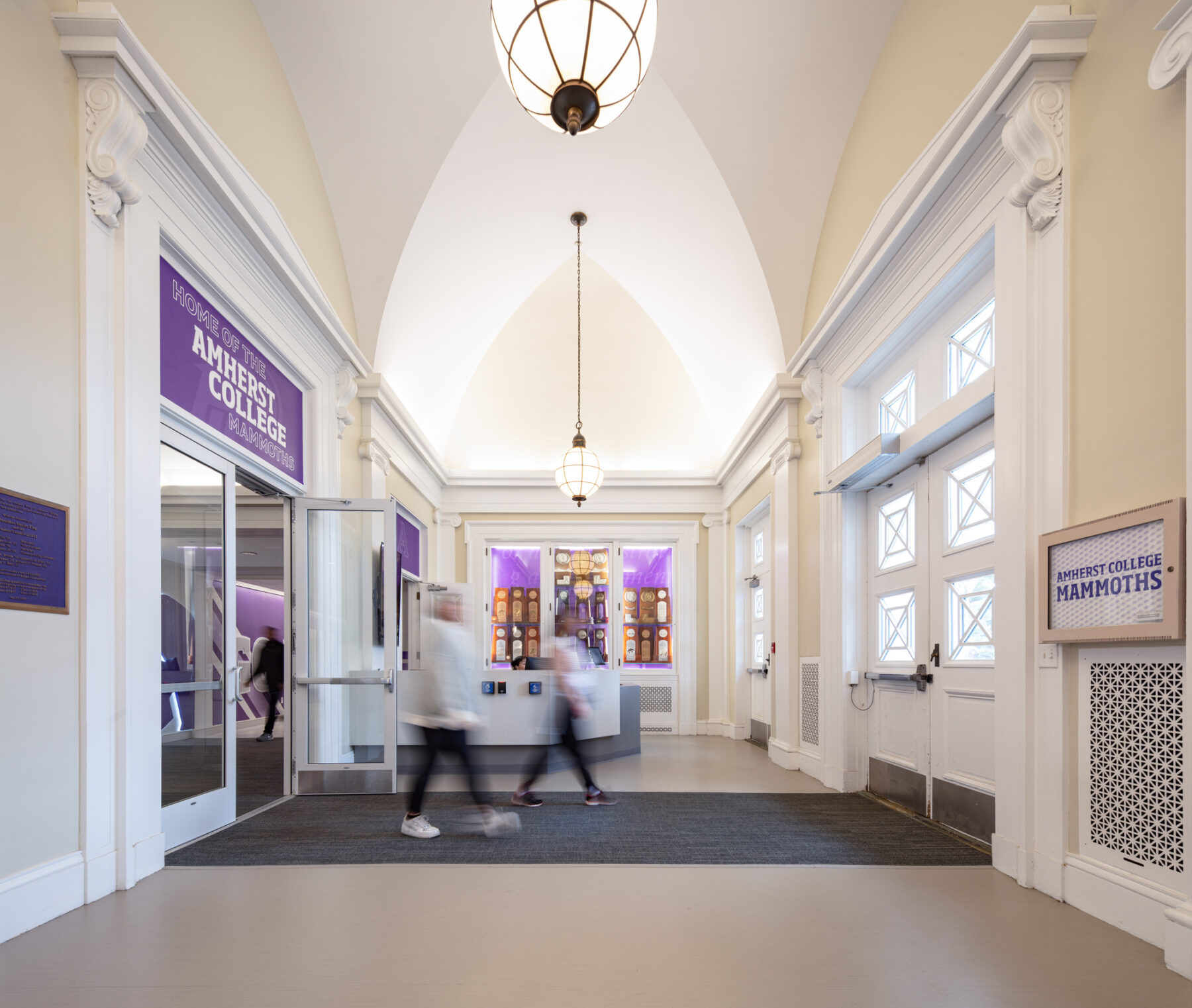 photograph of renovated vestibule space with students walking across frame