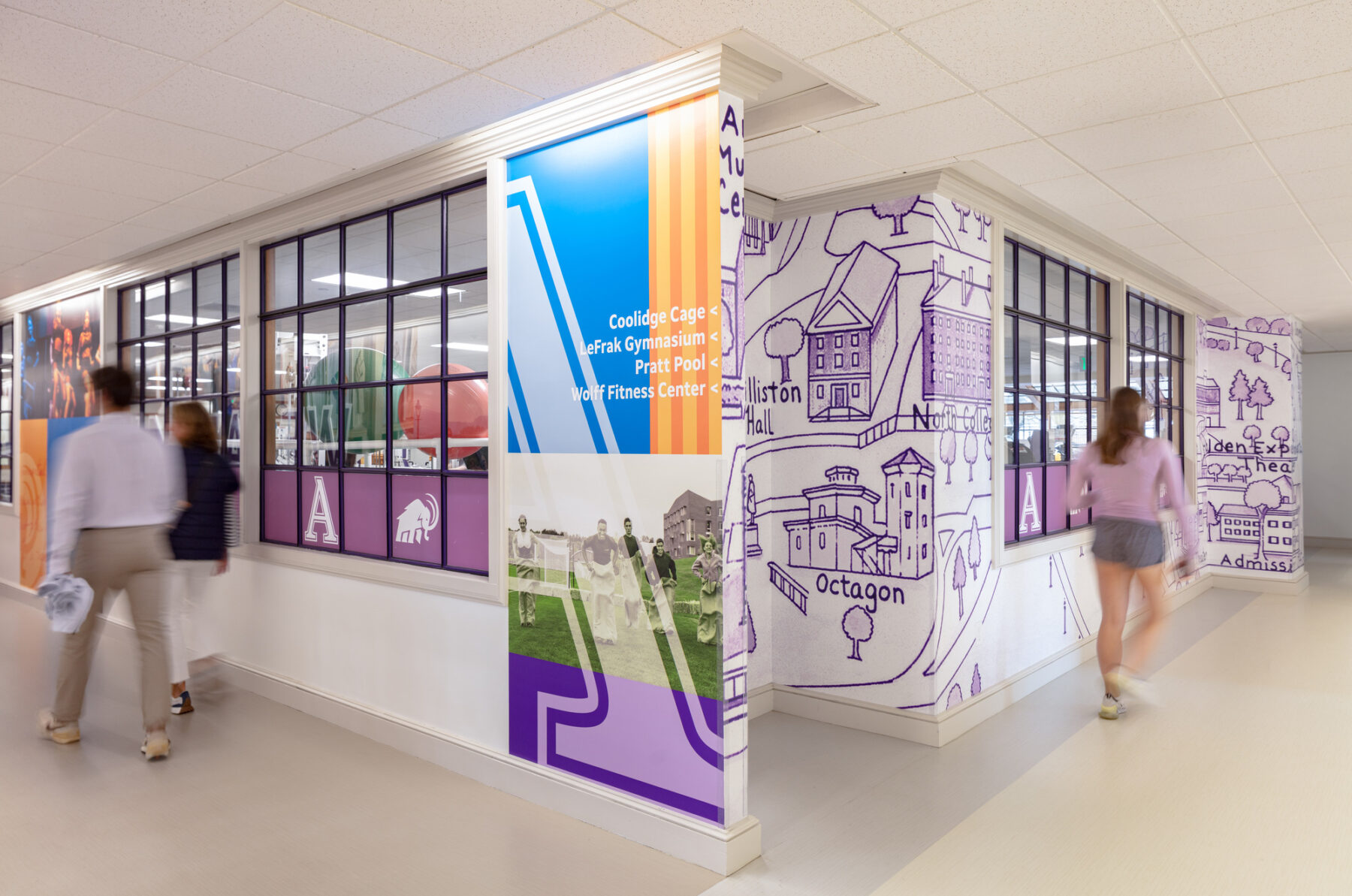 photograph of colorful graphics featuring collages and illustrated maps of campus