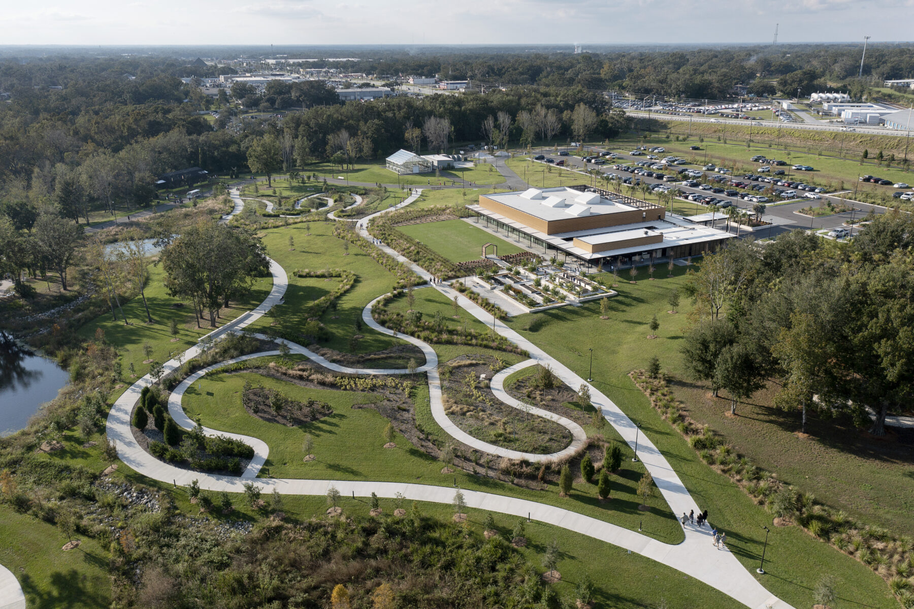 Aerial shot of the Bonnet Springs Park Event Center from the southeast showing the winding paths leading to it and around its lawn and botanical garden