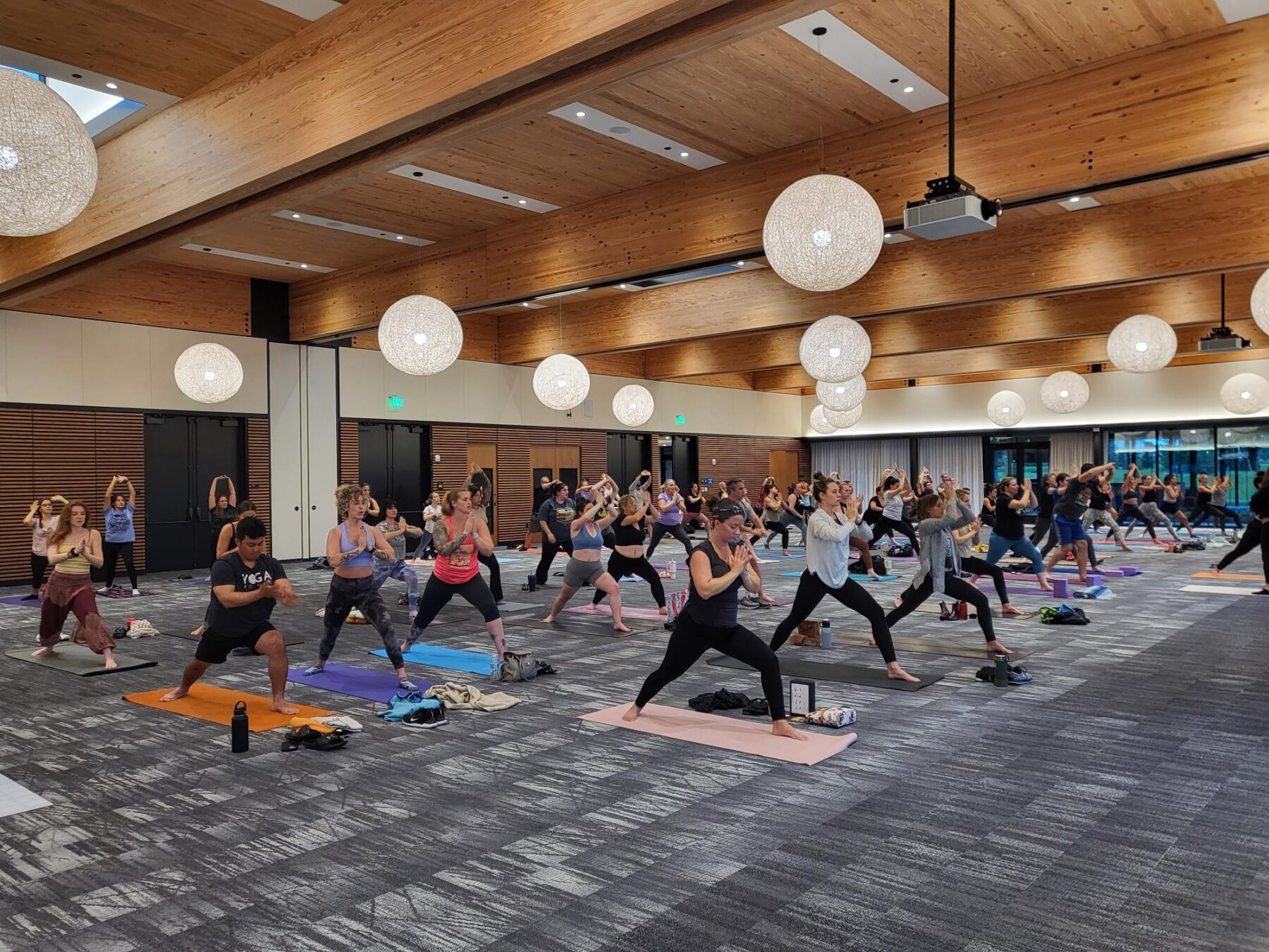 A yoga class underway at the Bonnet Springs Park Event Center ballroom.