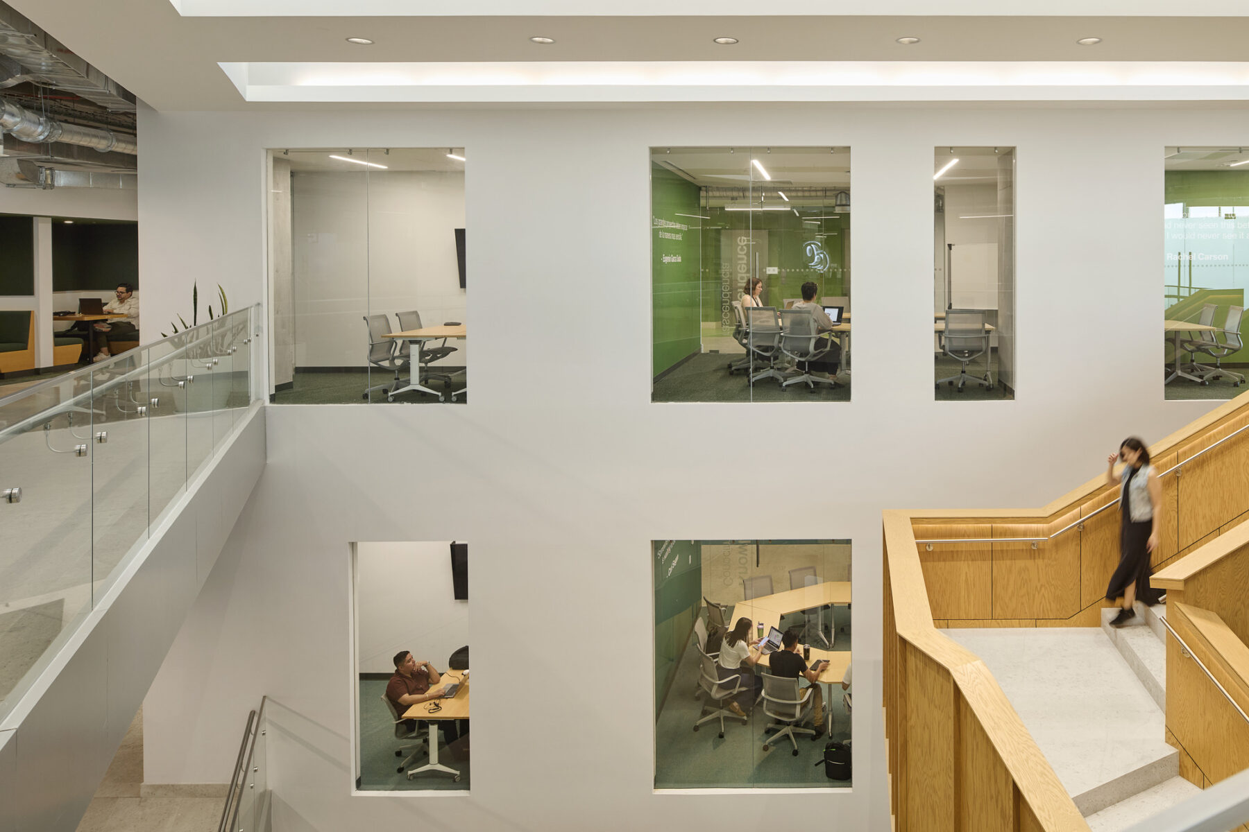 Interior photo showing the central building navigation and with stair case and views into meeting spaces across multiple floors