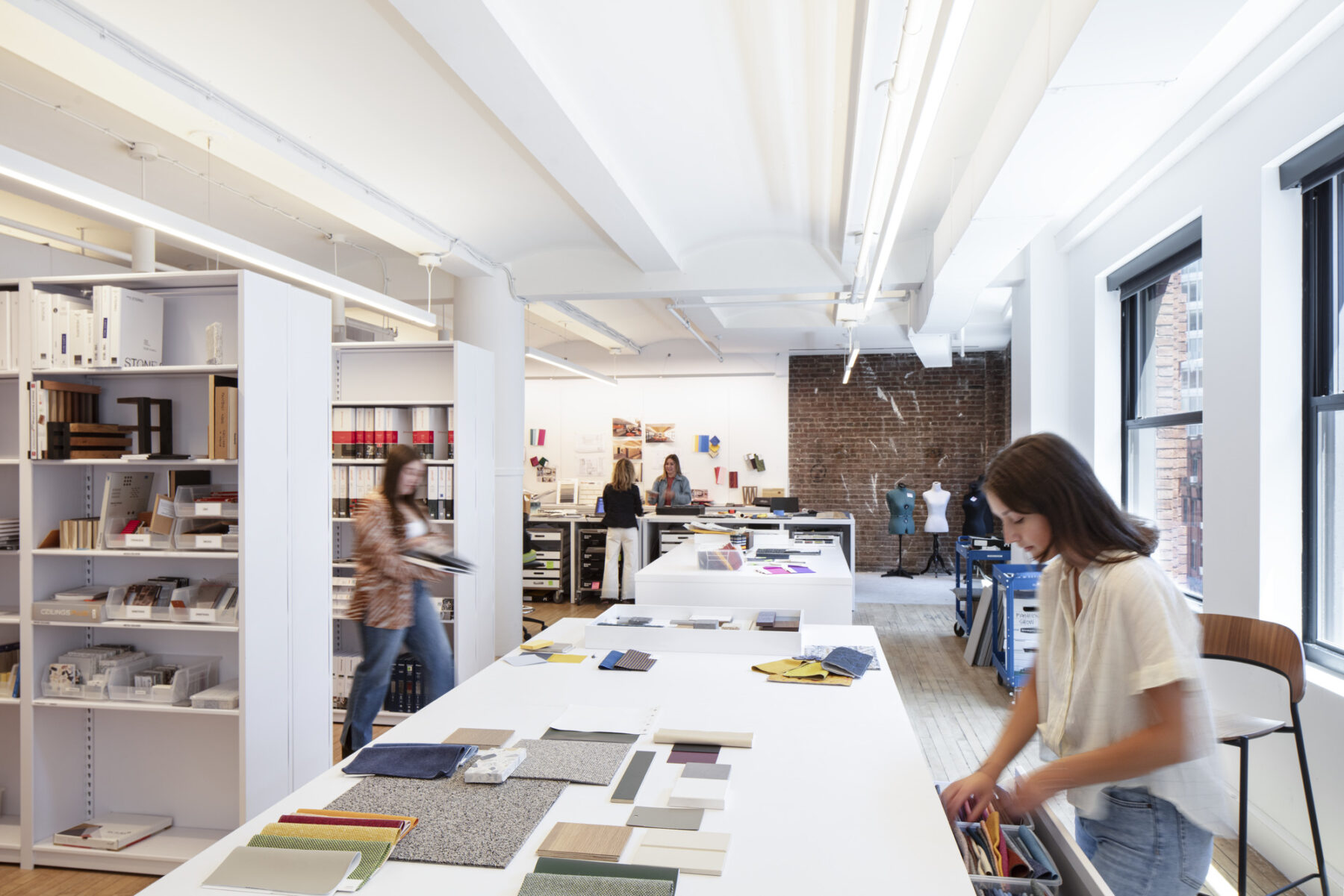 photograph of designer in material library