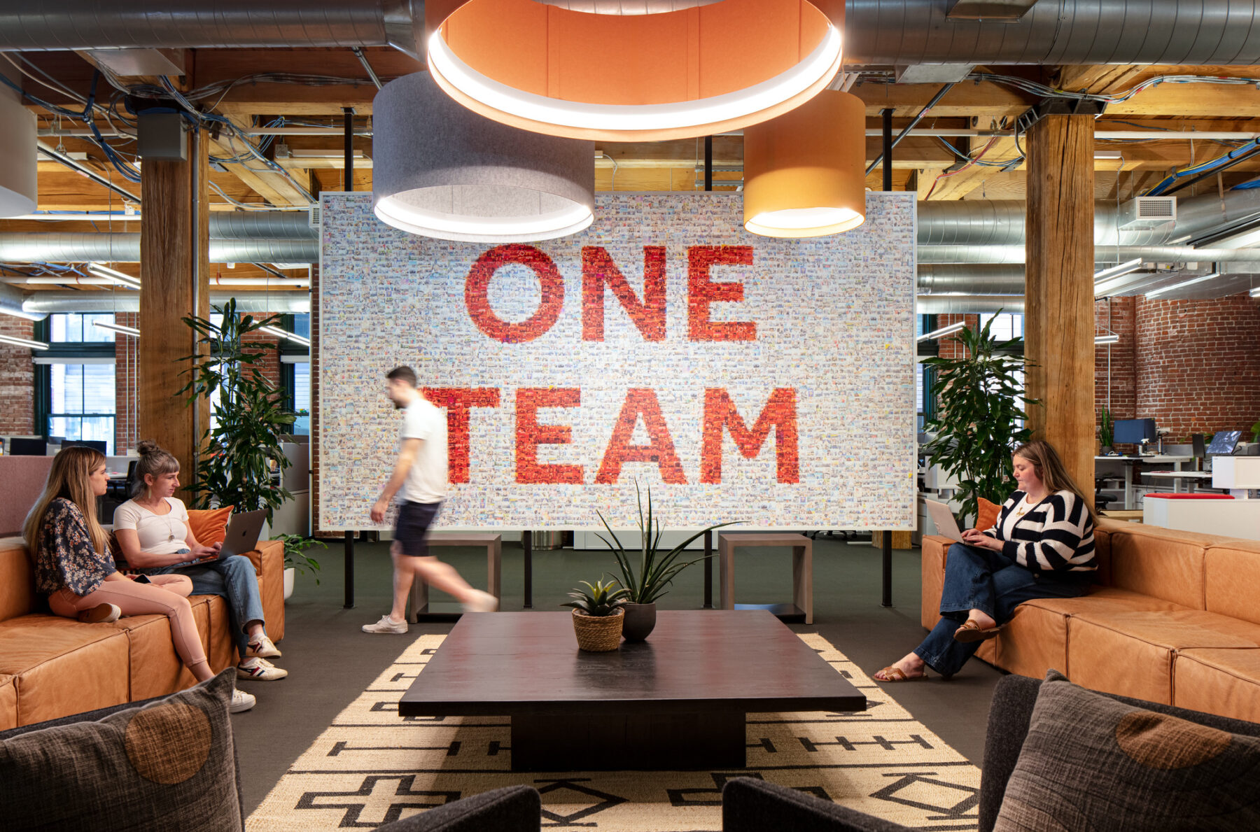 photograph of Team Collage Wall in social gathering space