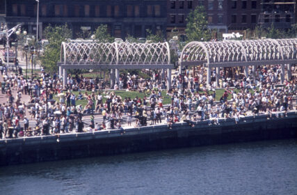 A very busy Waterfront Park viewing from the air with people filling the lawn and benches