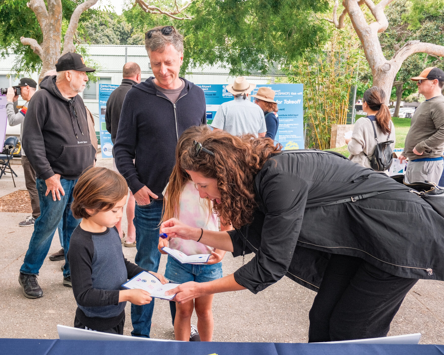 Anna Cawrse interacts with a local respondents at the Santa Monica Airport conversion project public event.