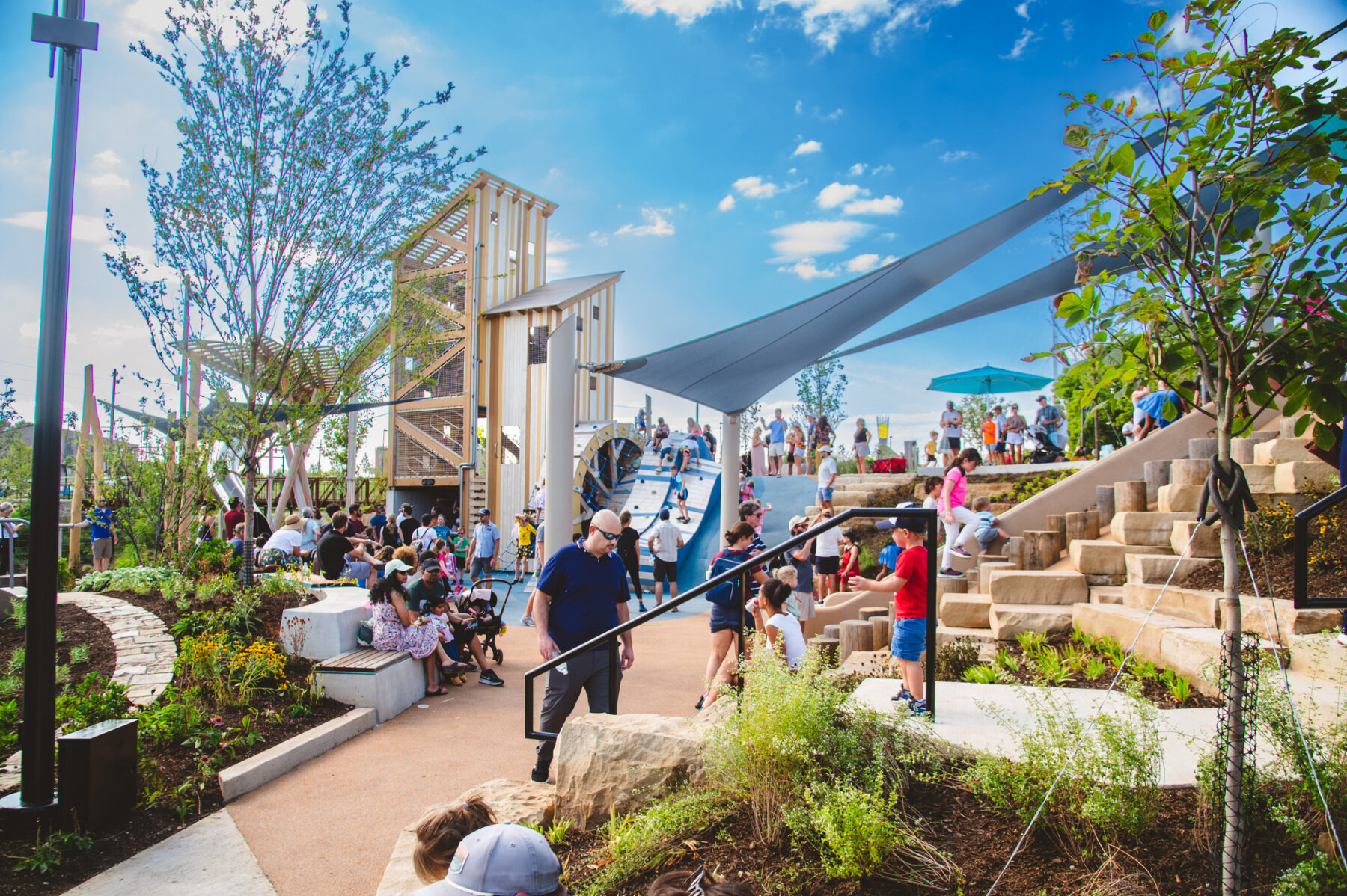 Photo of new playground area with surrounding planted areas