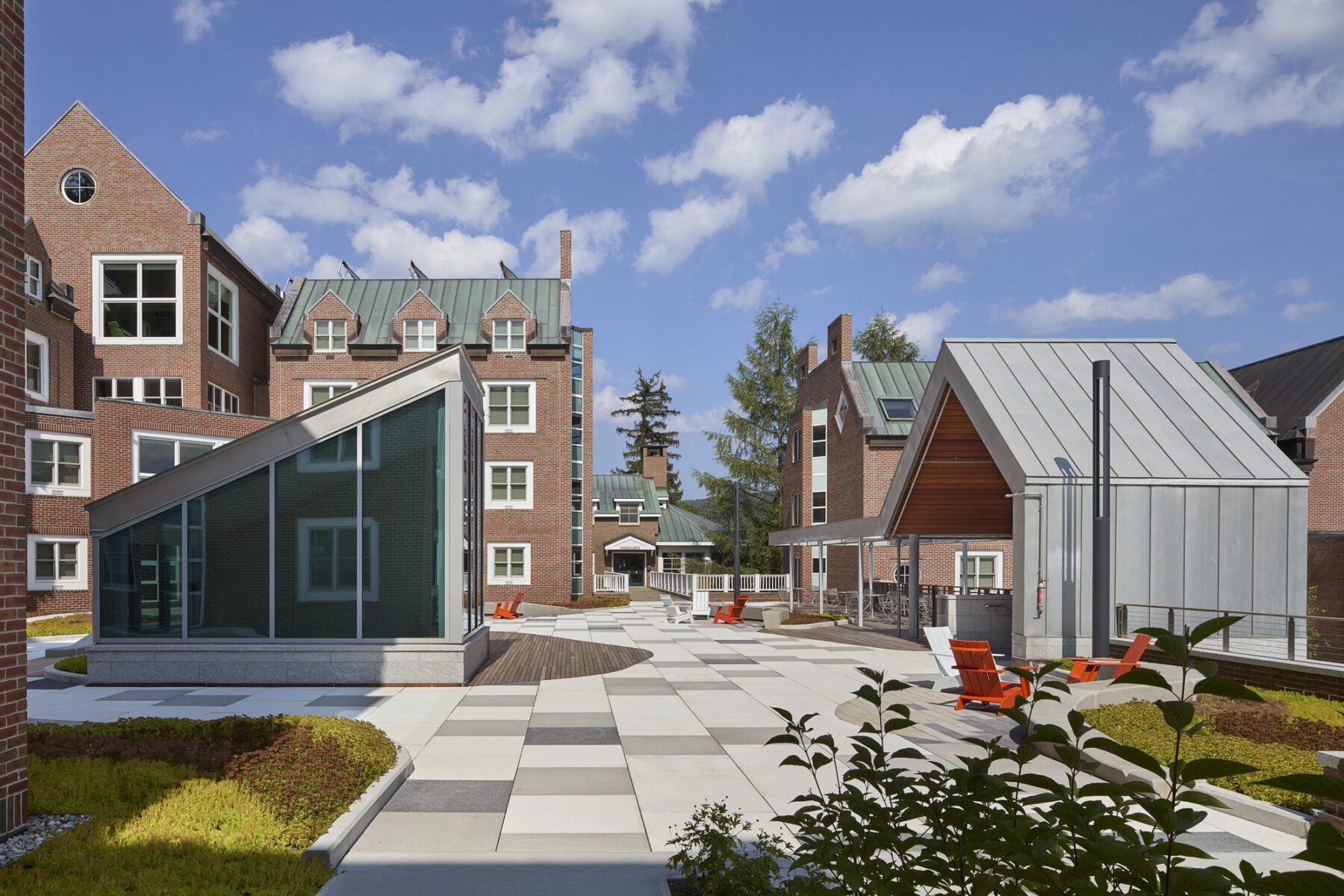 Photo of upper plaza with new paving, planting area, and movable furniture