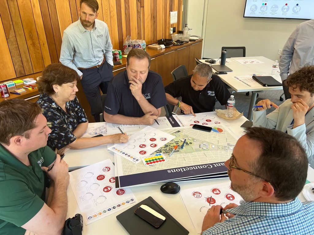 photo of community members and designer gathering insight