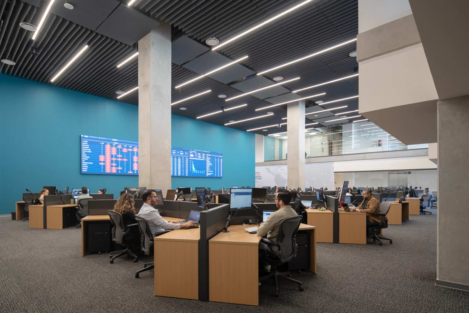 Interior photo of monitoring center with floating workstations organized in an open floor plan