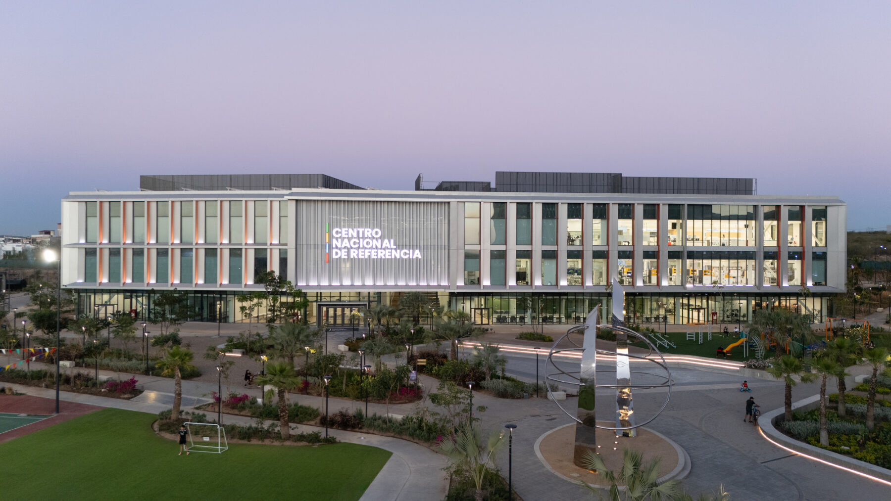 Exterior photo of a three story building sitting on a plaza with the name Centro Nacional de Referencia in the facade.
