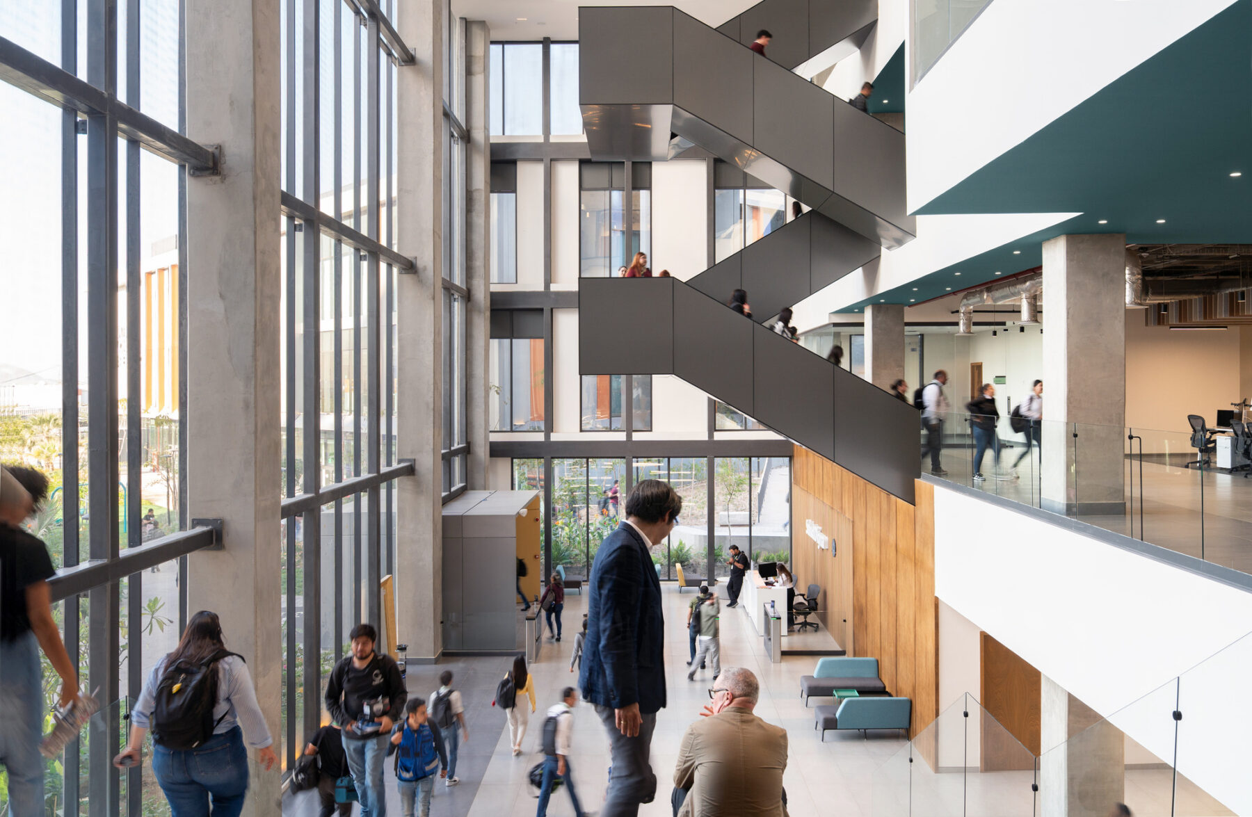 Interior photo of Salud Digna's headquarters' lobby seen from the top of the bleacher stairs