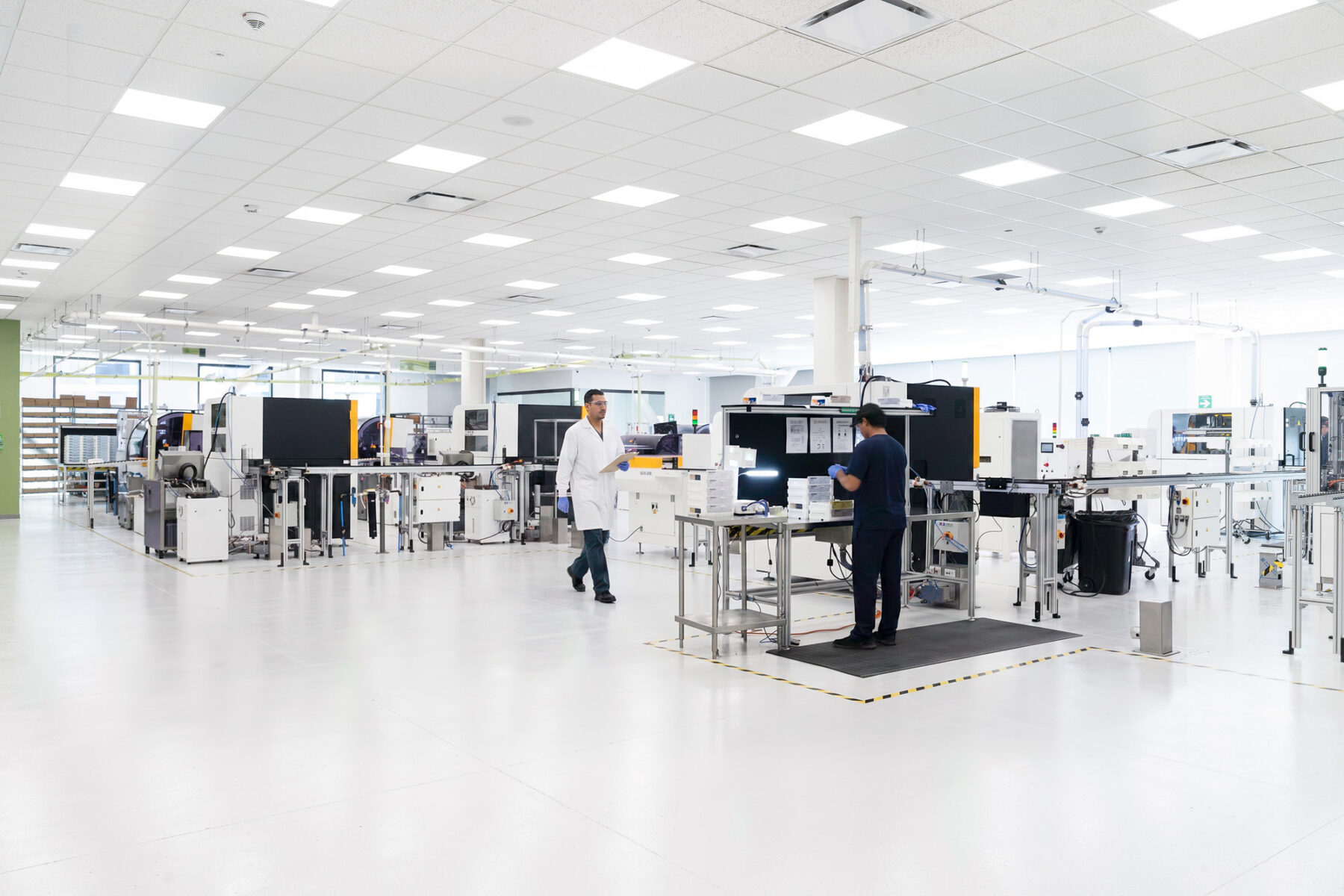 Interior photo of large laboratory with four optics machinery