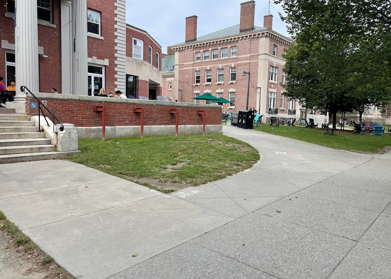 Before photo of the Collis Center exterior sidewalk and stairway leading to the porch.