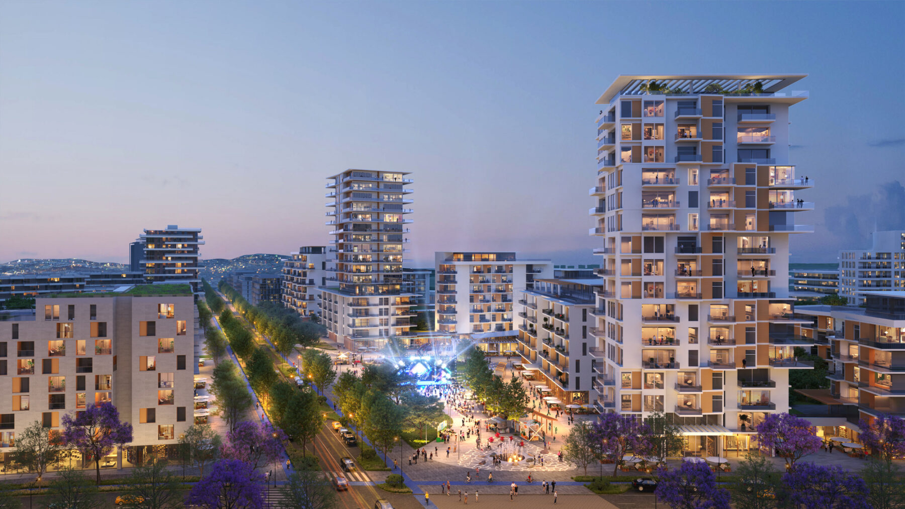 Aerial rendered view of Yumana Urban District showing a multi-modal street, an outdoor event with a stage along with high-rise towers representing new development