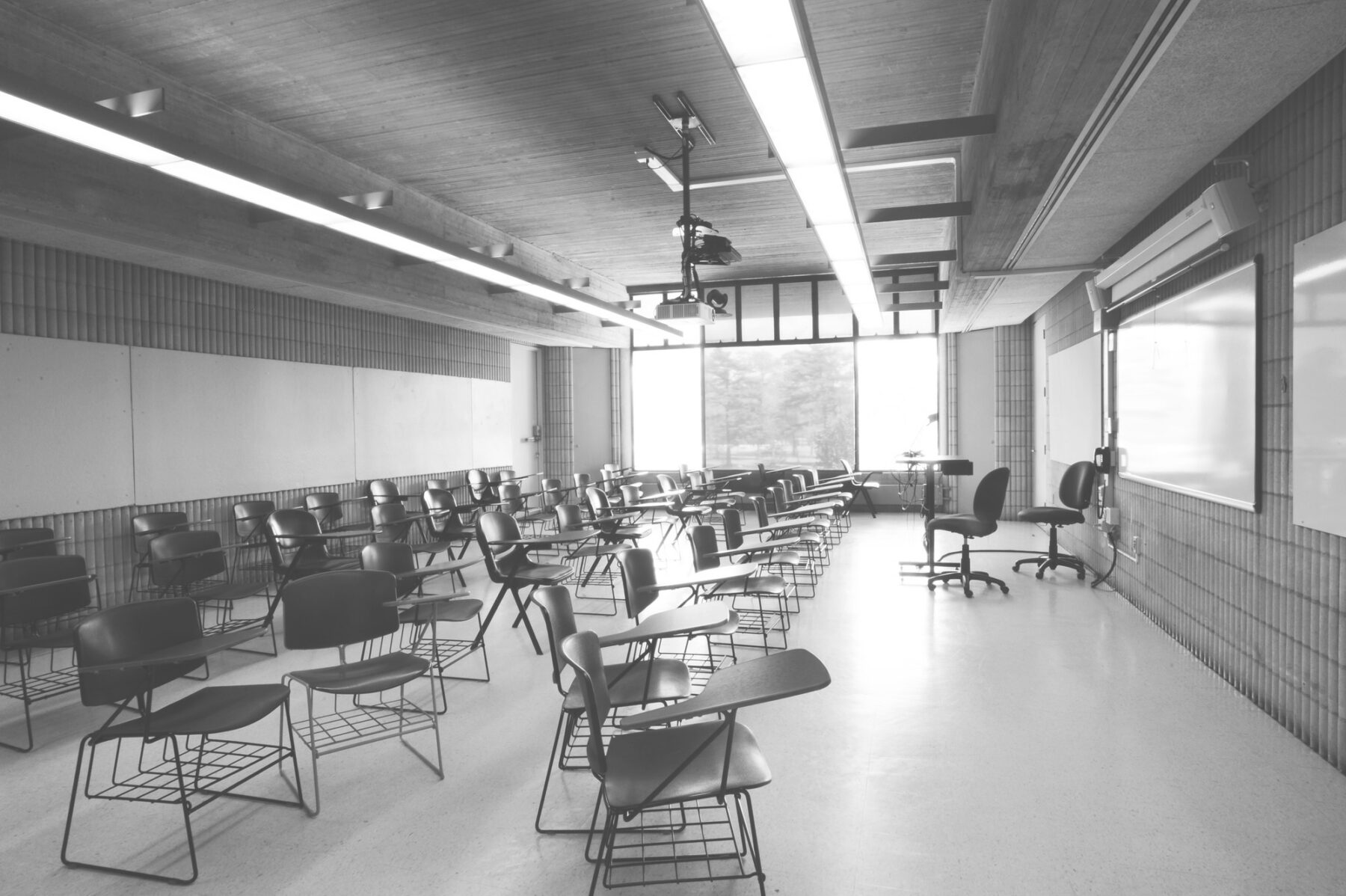 black and white photo of empty classroom